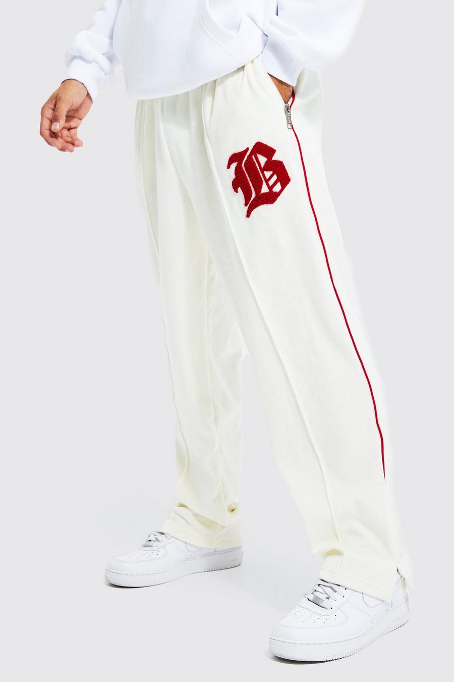 Pantalón deportivo de velvetón y holgura ancha con estampado universitario, Ecru image number 1
