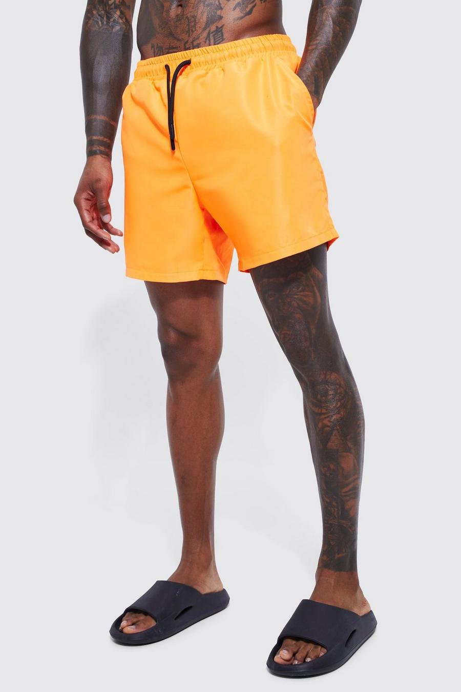 Neon-orange Mellanlånga badshorts