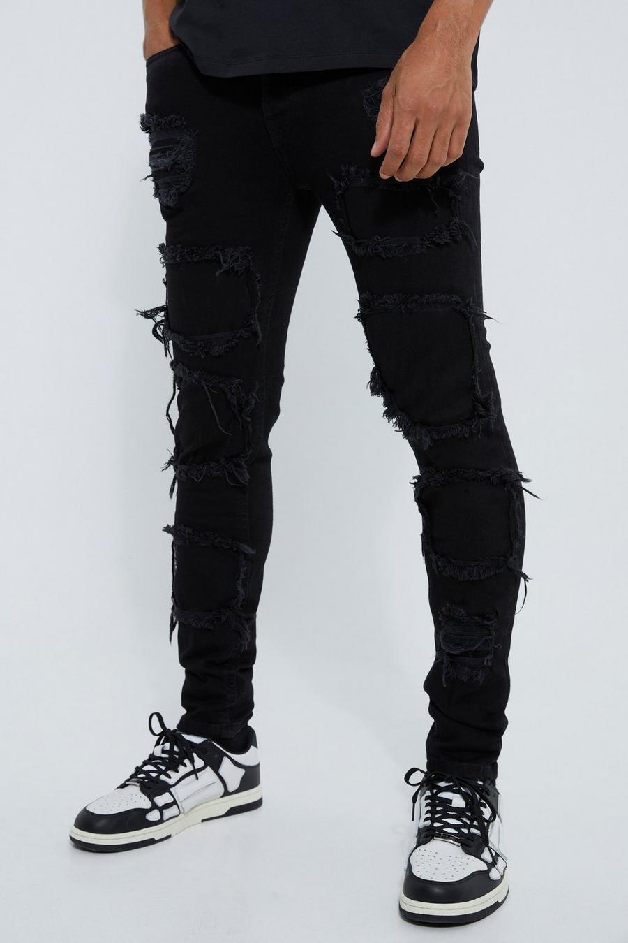 Jeans Skinny Fit strappati con pieghe sul fondo e smagliature, True black