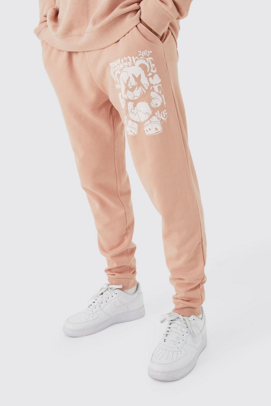 Pantalón deportivo oversize de borreguito sintético con grafiti, Dusty pink