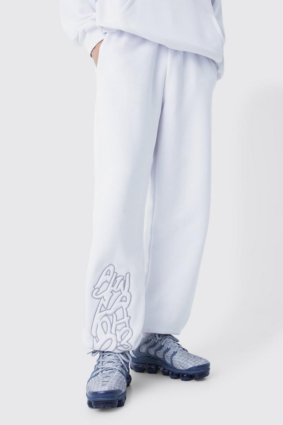Pantalón deportivo oversize Worldwide con estampado de grafiti, White
