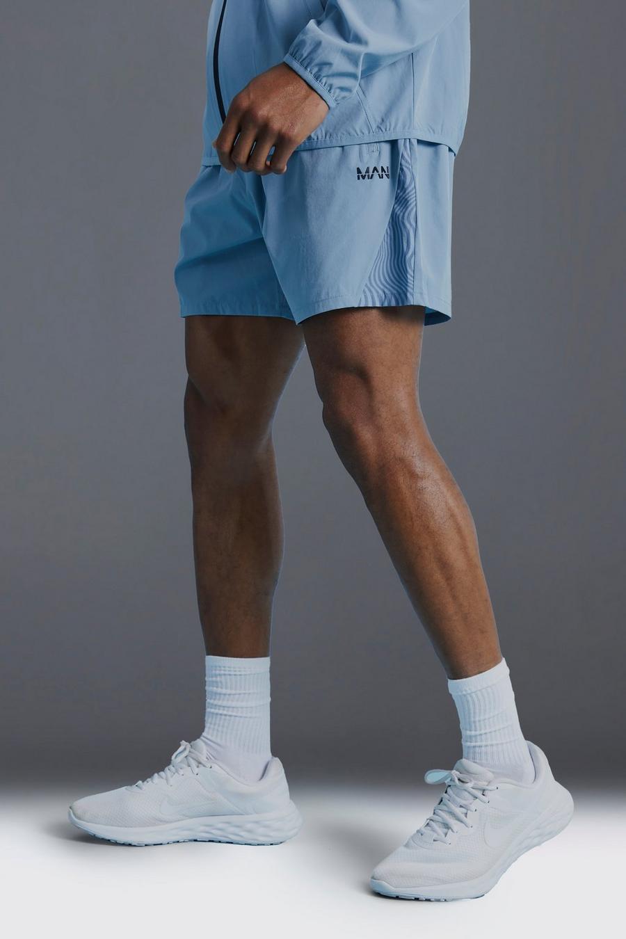 Pantaloncini Man Active con pannelli e stampa di motivi geometrici, Light blue