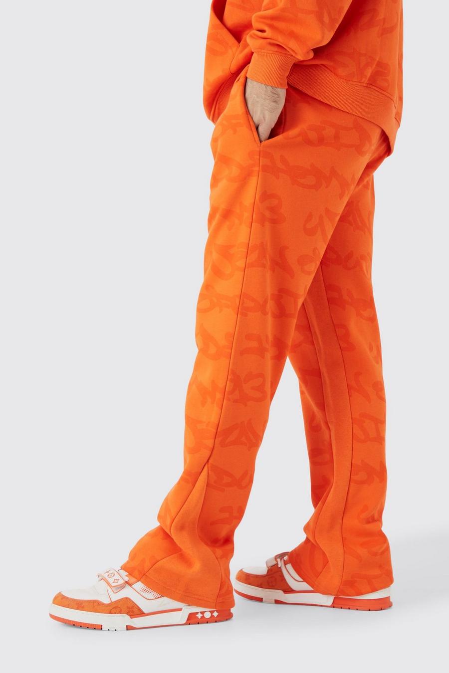 Pantalón deportivo con refuerzos y estampado de grafiti, Orange