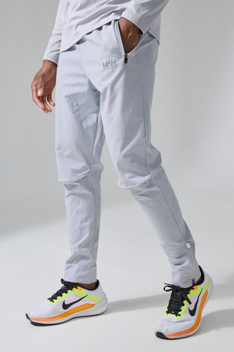 Pantaloni tuta da corsa Man Active con spacco sul ginocchio, Grey image number 1