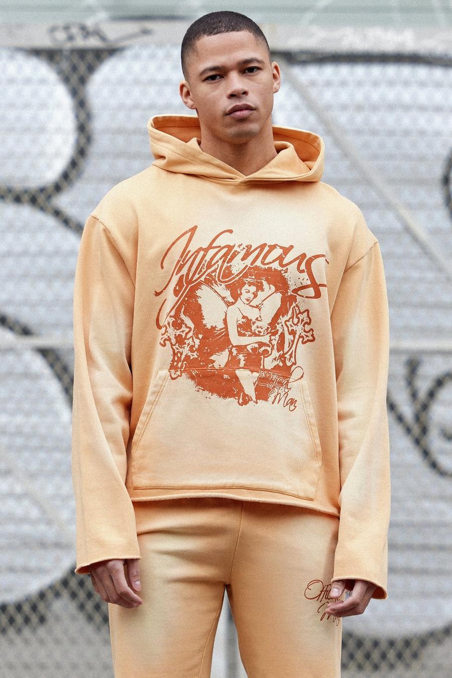 Orange Oversize hoodie med stentvättad effekt och rå kant