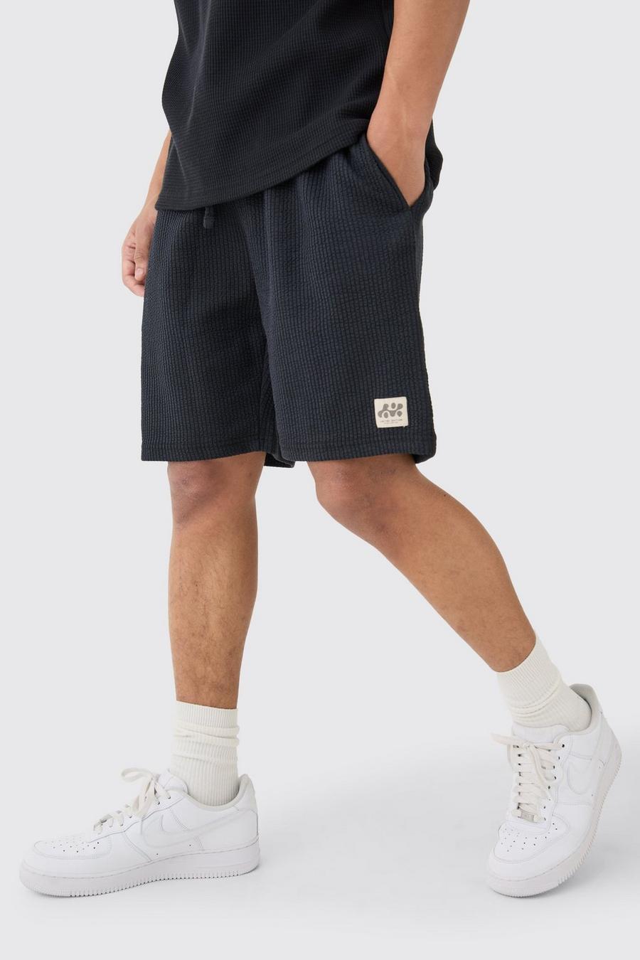 Black Relaxed Mid Length Textured Short With Woven Tab