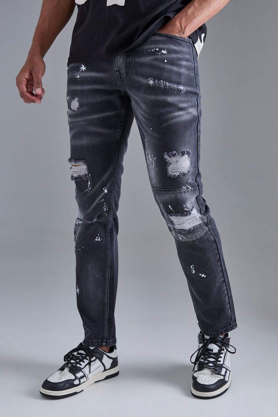 Jeans Slim Fit in denim rigido con strappi sul ginocchio e dettagli dipinti all over, Washed black