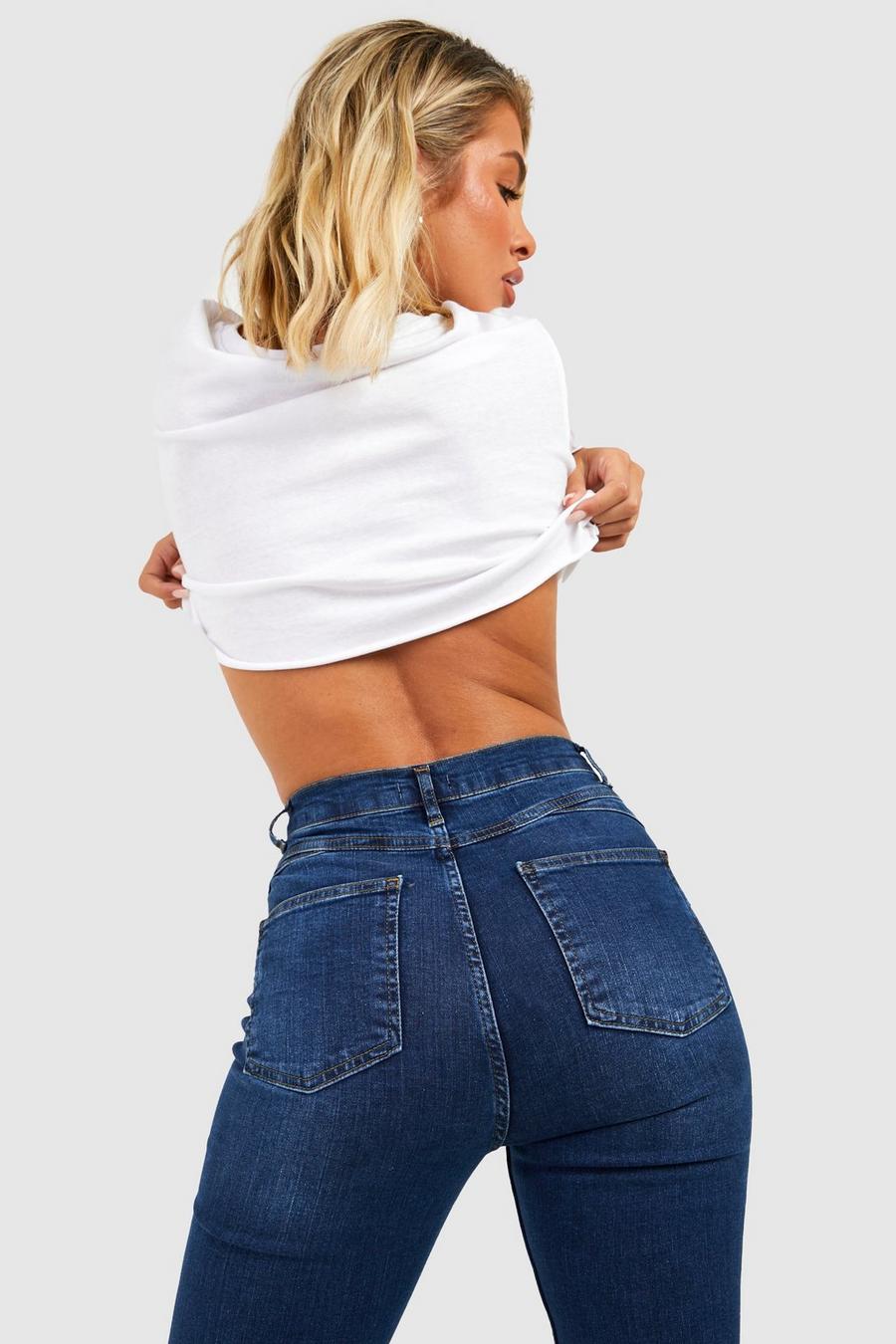 Indigo Strakke Booty Boosting Mid Rise Jeans Met Wijd Uitlopende Pijpen