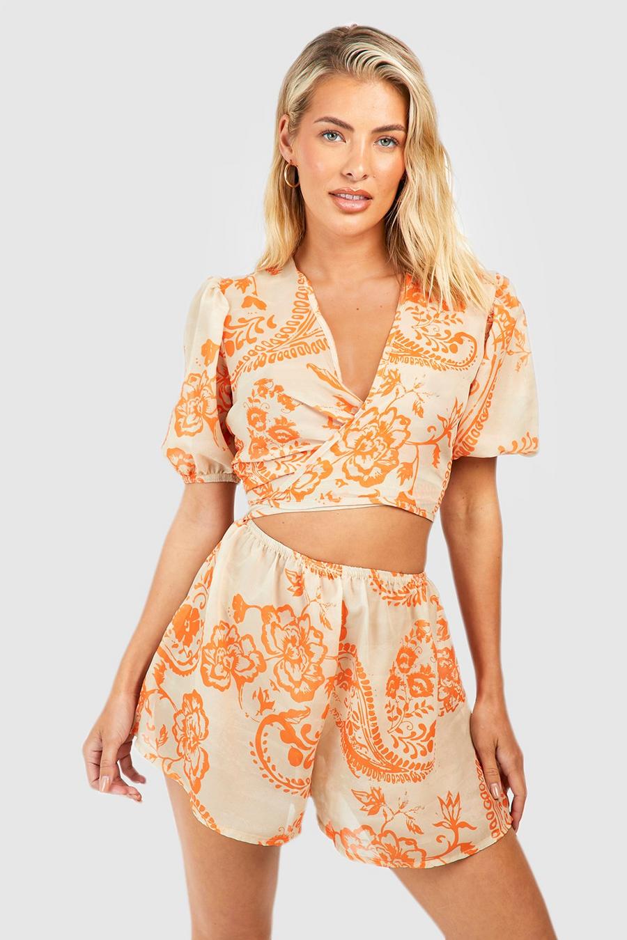 Orange Mönstrad strandplaysuit i chiffong med omlott