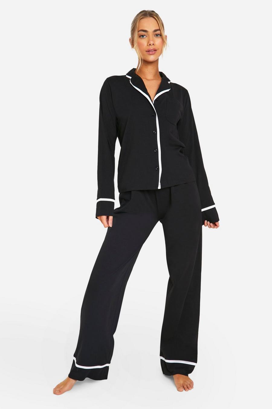 Black Långärmad pyjamas i jersey med kantband och knappar image number 1