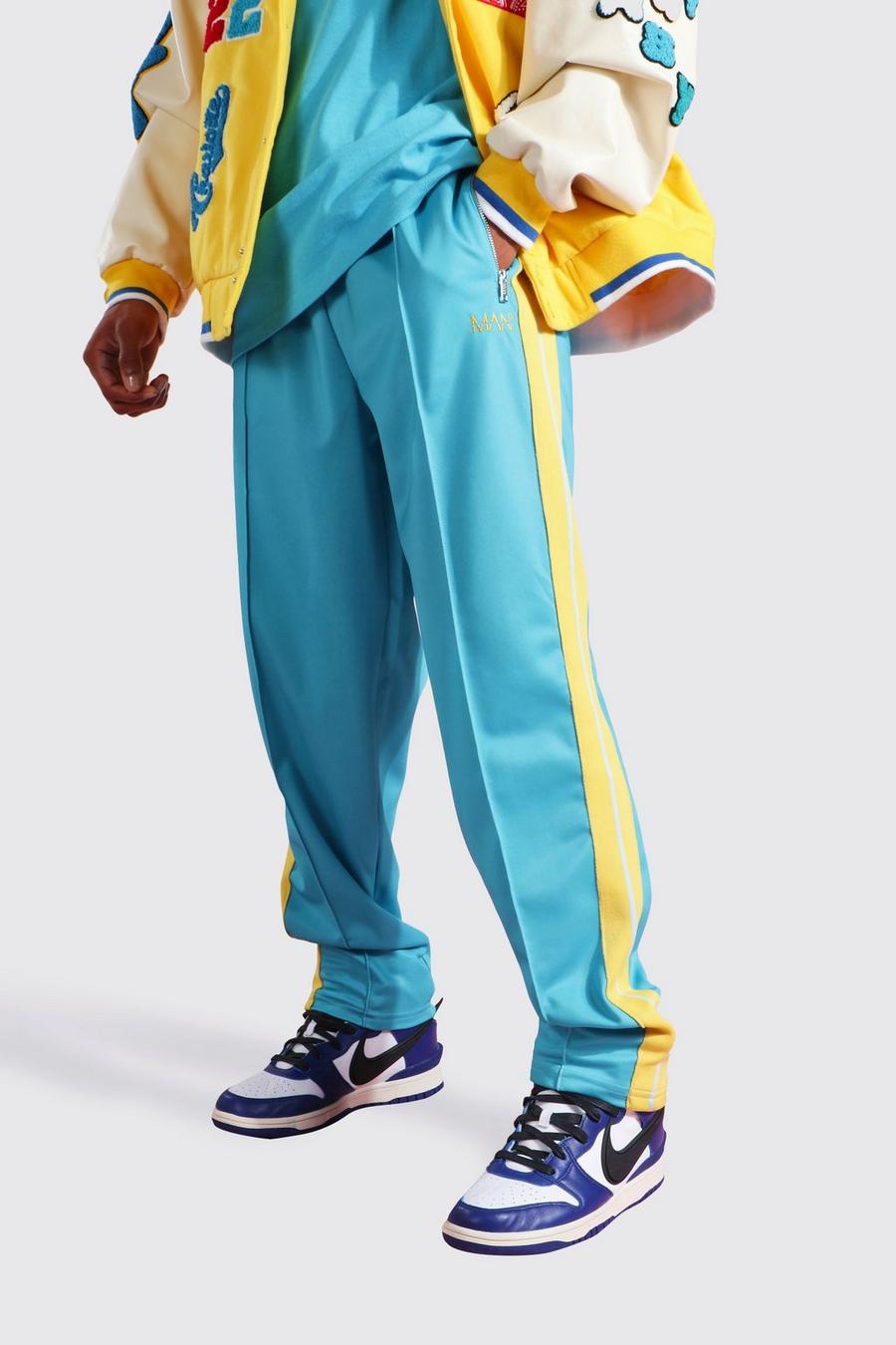 Pantalón deportivo de pernera ancha y tejido por urdimbre con línea lateral, Blue image number 1