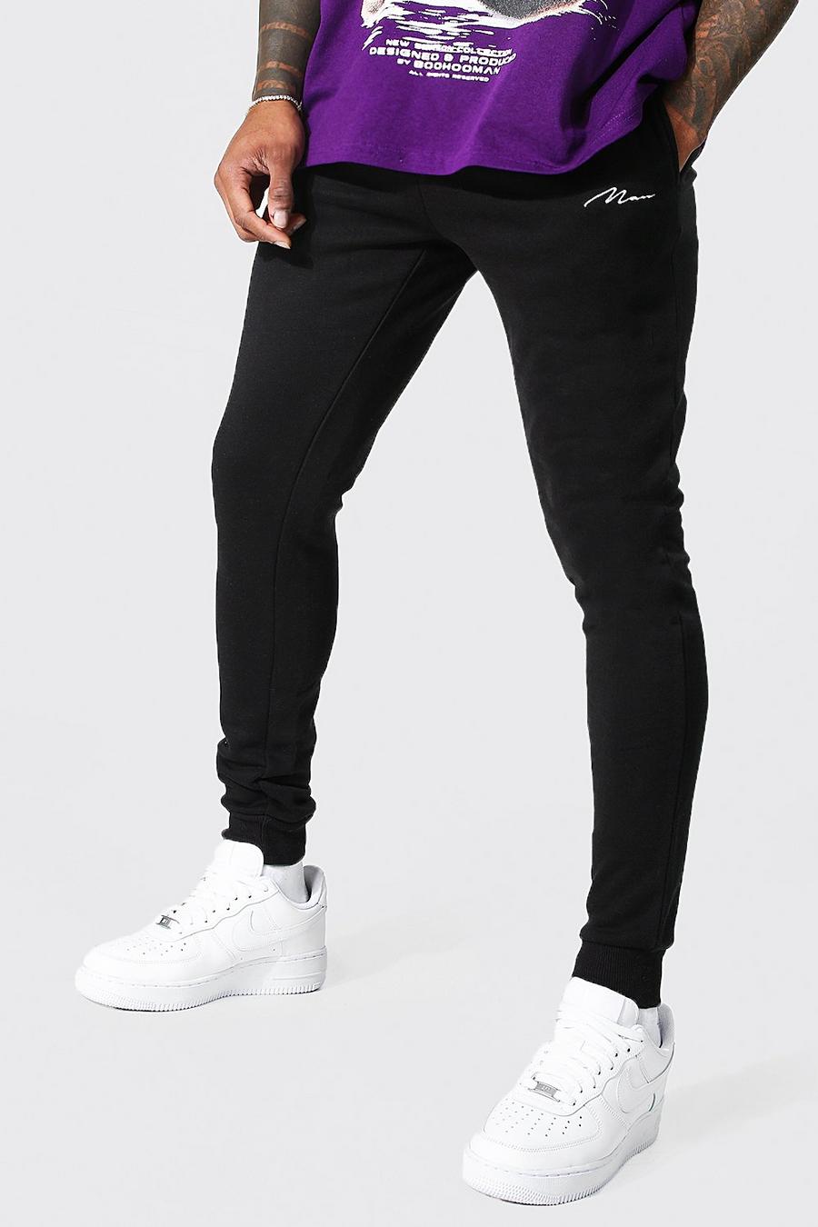 Pantaloni tuta Super Skinny Fit in fibre riciclate con firma Man, Black negro image number 1