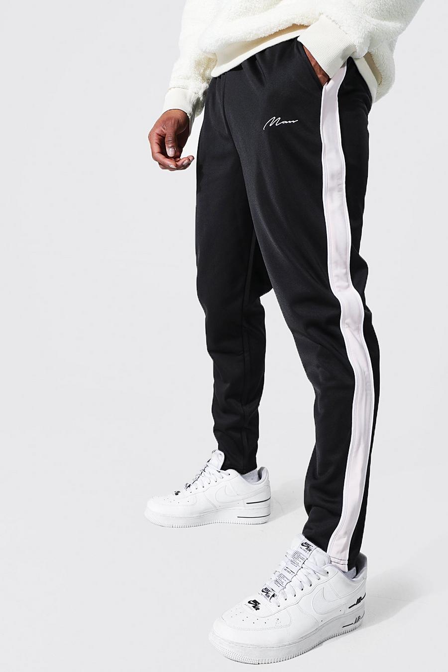 Pantalón deportivo pitillo de tejido por urdimbre con panel lateral, Black negro image number 1