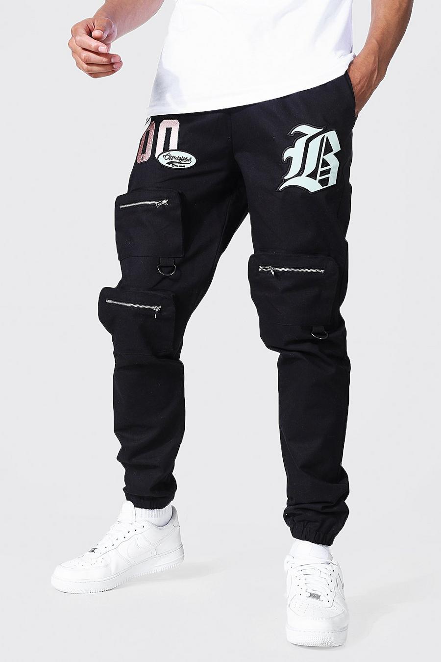 Pantaloni tuta Cargo Tall stile Varsity con tasche frontali, Black