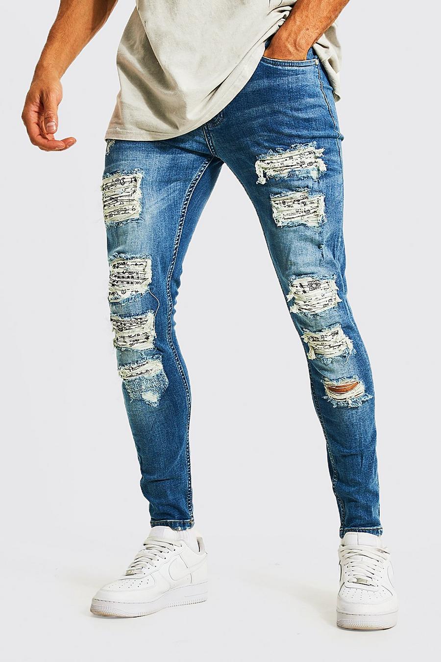 Light blue Super skinny jeans med bikerdetaljer och slitage image number 1