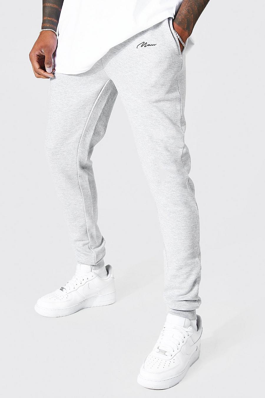 Pantalón deportivo súper pitillo con firma MAN, Grey gris image number 1
