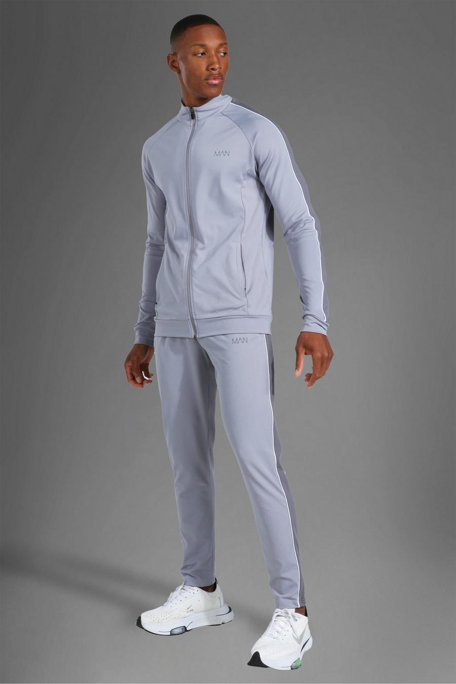 אפור חליפת טרנינג ספורטיבית עם רוכסן מלא, פס בצד וכיתוב MAN image number 1