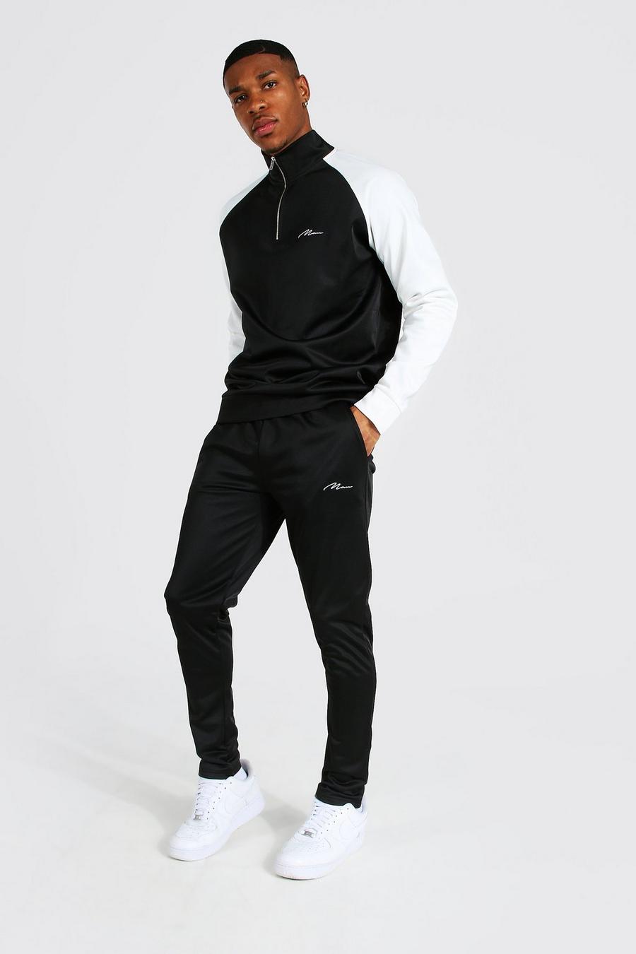 שחור חליפת טרנינג מבד טריקו עם צווארון משפך וצבעים מנוגדים עם כיתוב Man image number 1