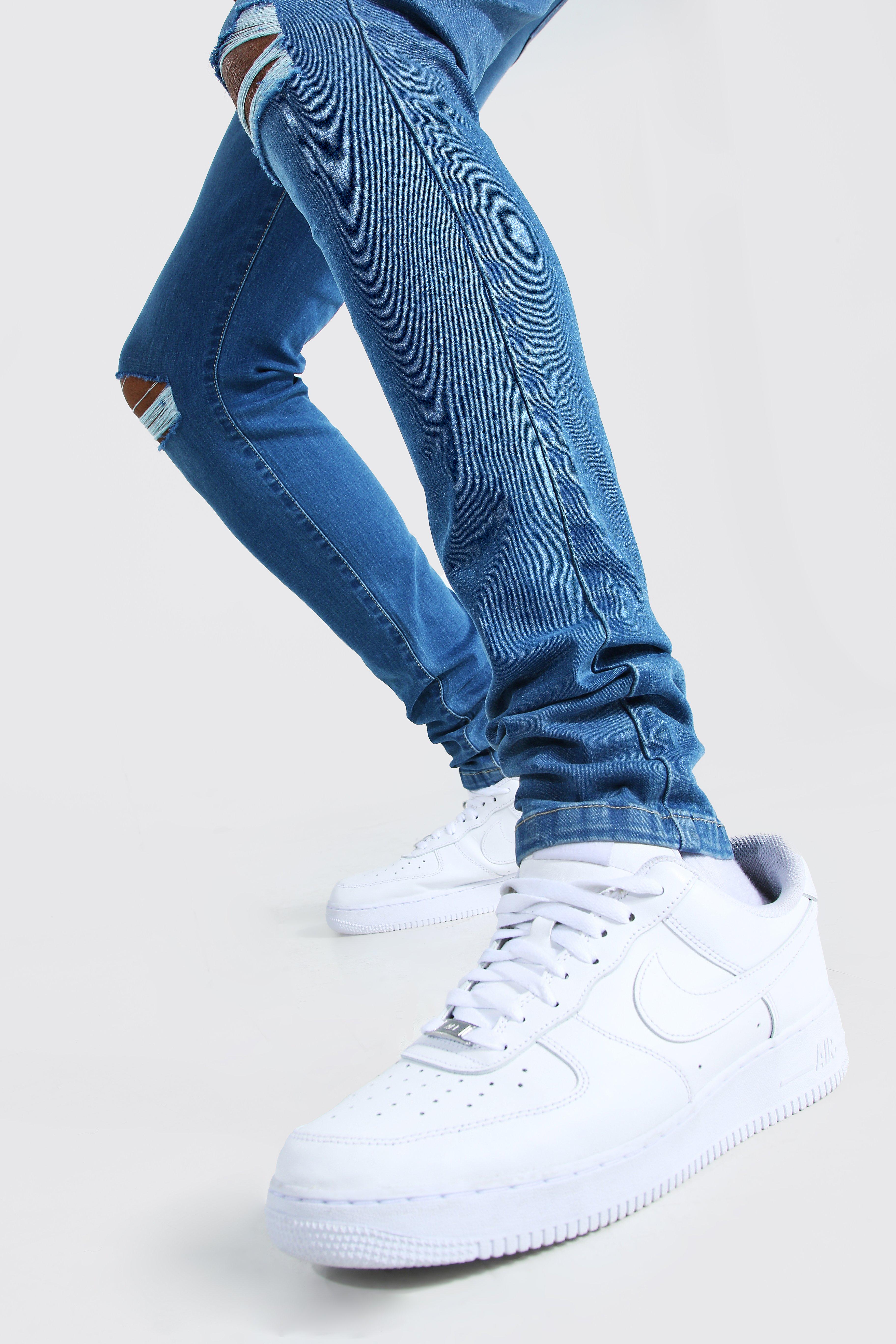 light blue ripped knee skinny jeans