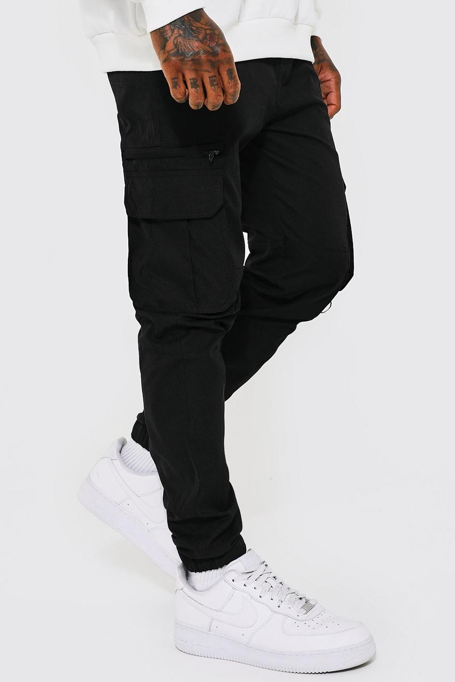 Pantalón cargo MAN ajustado elástico de tela shell, Black negro image number 1