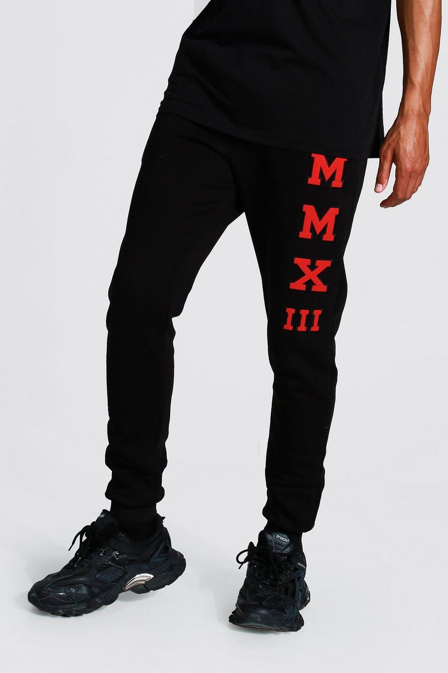 Pantaloni tuta Skinny Fit Tall con applicazione, Black negro image number 1