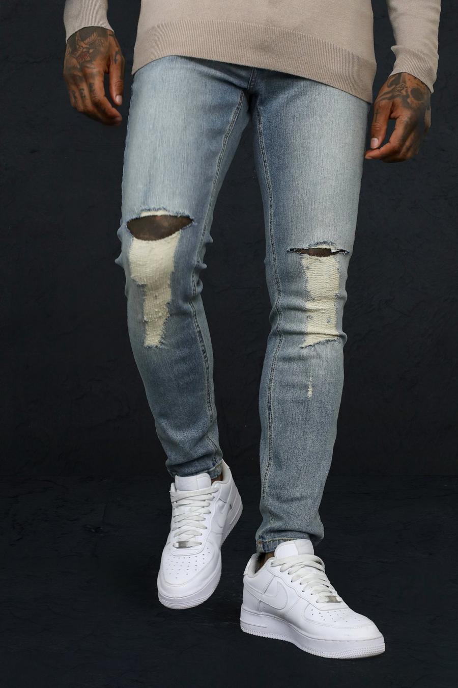 Mid blue blå Skinny jeans med stretch och slitna knän image number 1