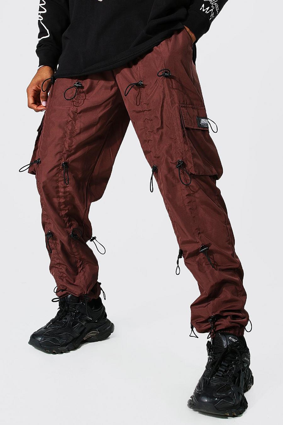 Brown Man Loose Fit All Over Toggle Cargo Trousers image number 1