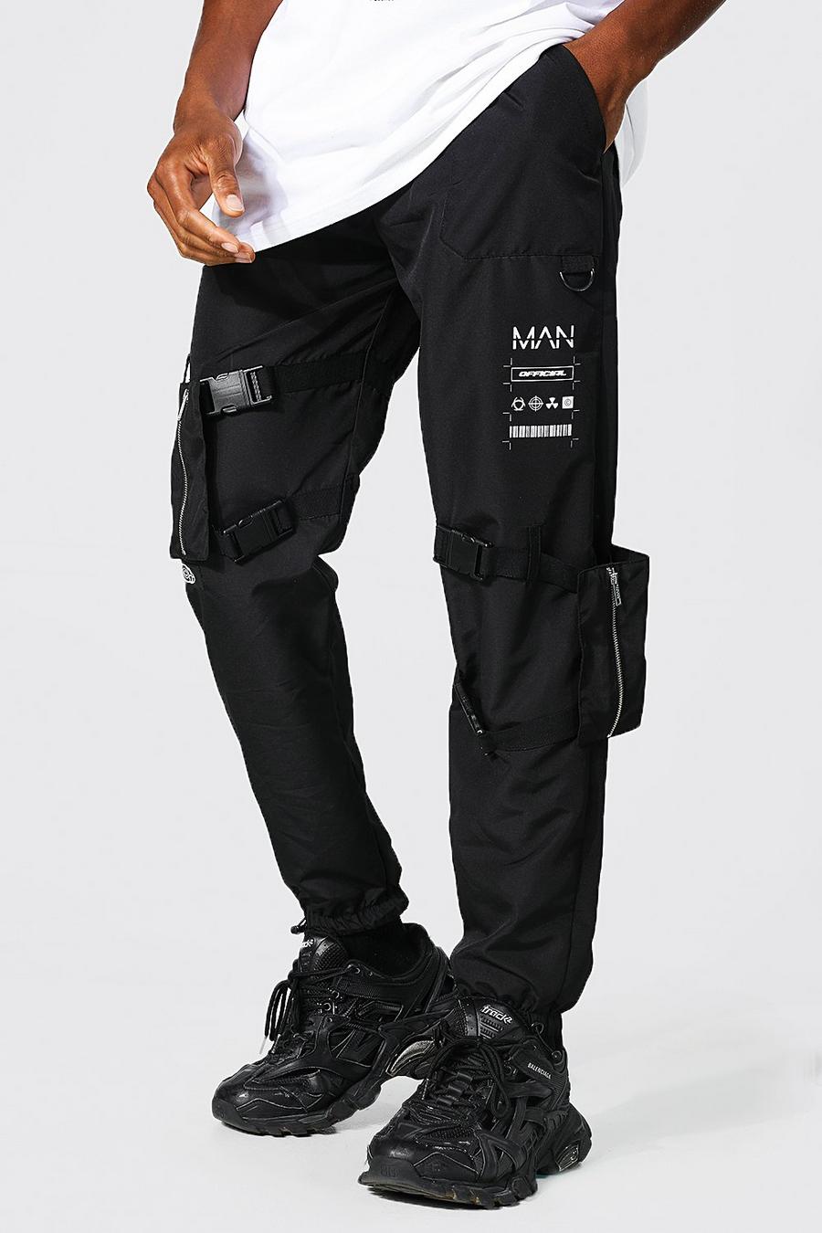שחור מכנסי דגמ"ח בציפוי עמיד עם כיס ניתן להחלפה וכיתוב Man image number 1