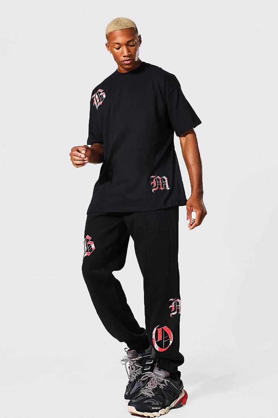 Pantalón deportivo y camiseta oversize con apliques y estampado bandana, Black nero image number 1