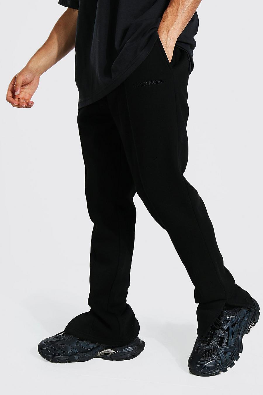 שחור מכנסי ריצה בגזרה צרה עם מכפלת חצויה וכיתוב Man Official image number 1