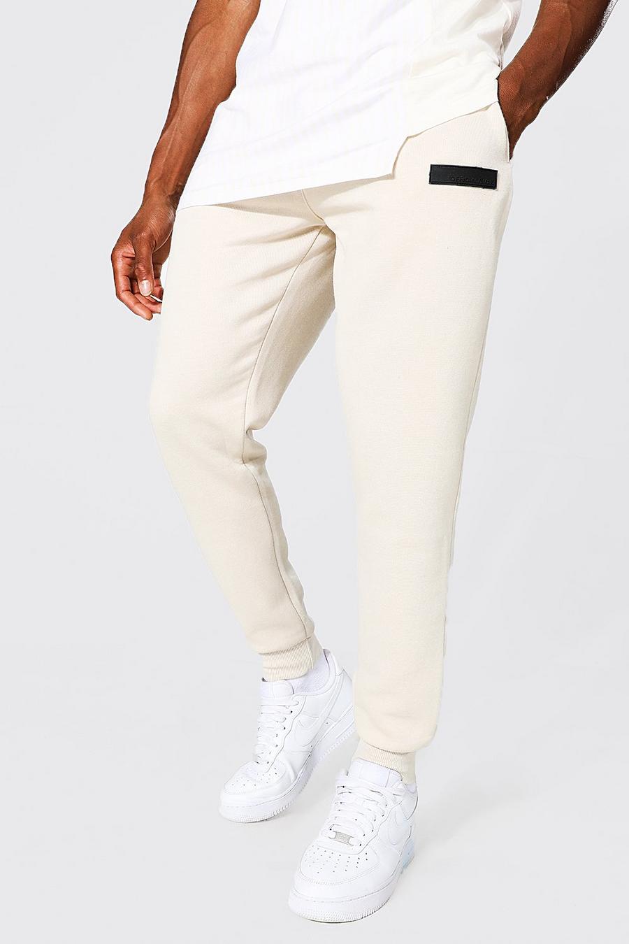 Pantaloni tuta Skinny Fit con etichetta in gomma, Pumice stone grigio image number 1