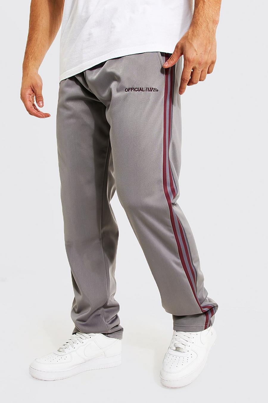 Pantalón deportivo holgado de tejido por urdimbre con franja lateral image number 1