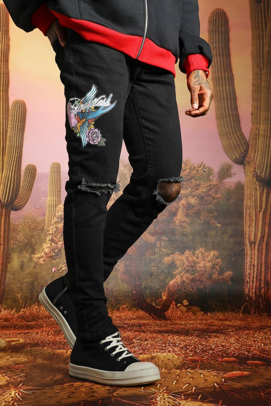 שחור אמיתי ג'ינס סקיני קשיח עם הדפס ריינסטון וקרעים בברכיים image number 1