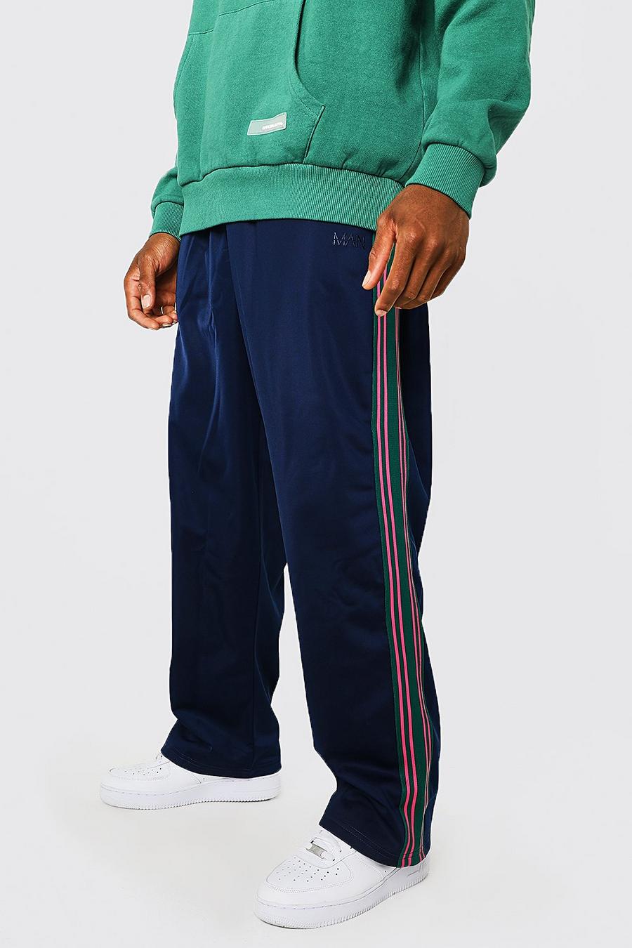 Pantalón deportivo de tejido por urdimbre con pernera ancha y franja lateral, Navy azul marino image number 1