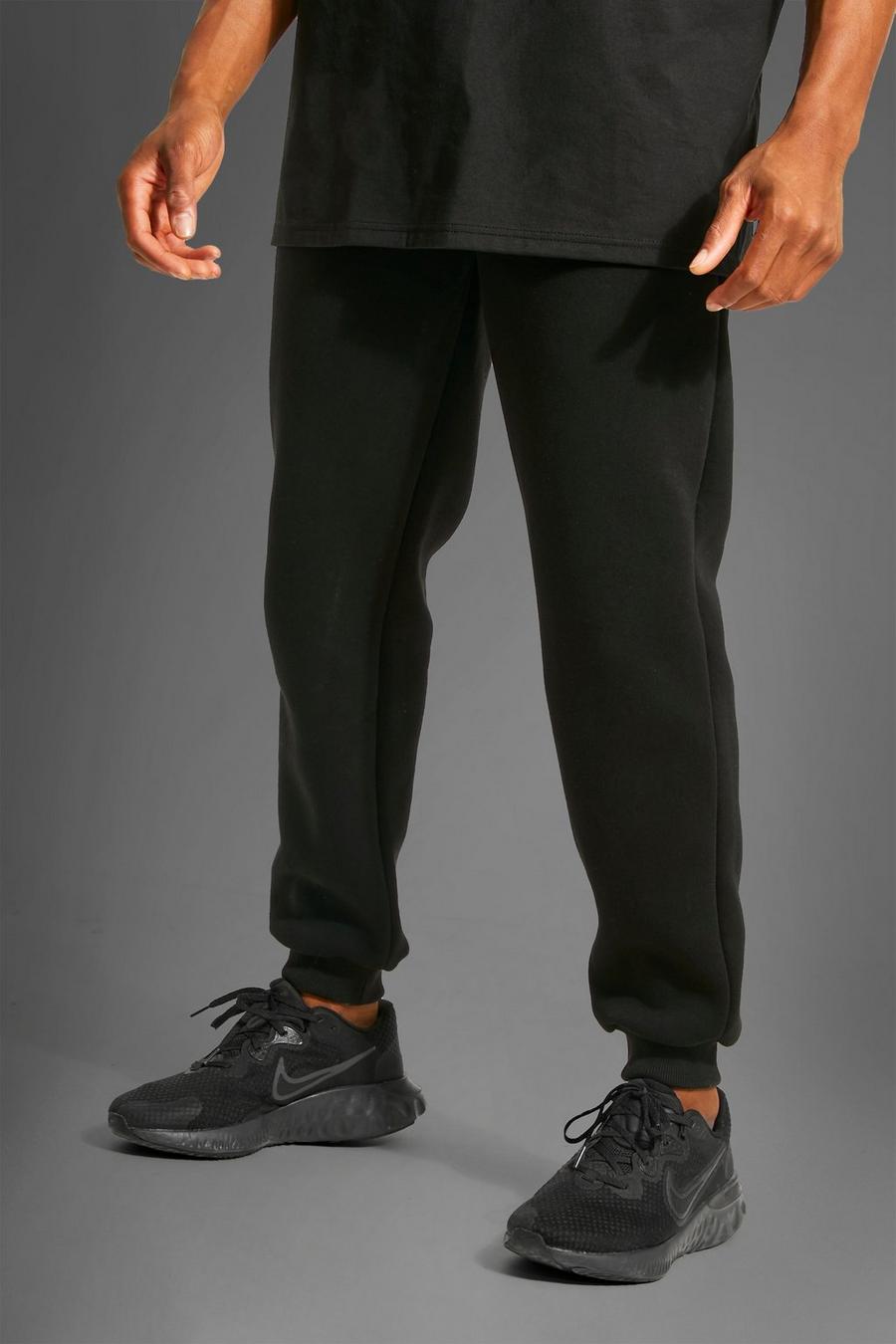שחור מכנסיים ספורטיביים לחדר הכושר בגזרה משוחררת עם כיתוב Man image number 1