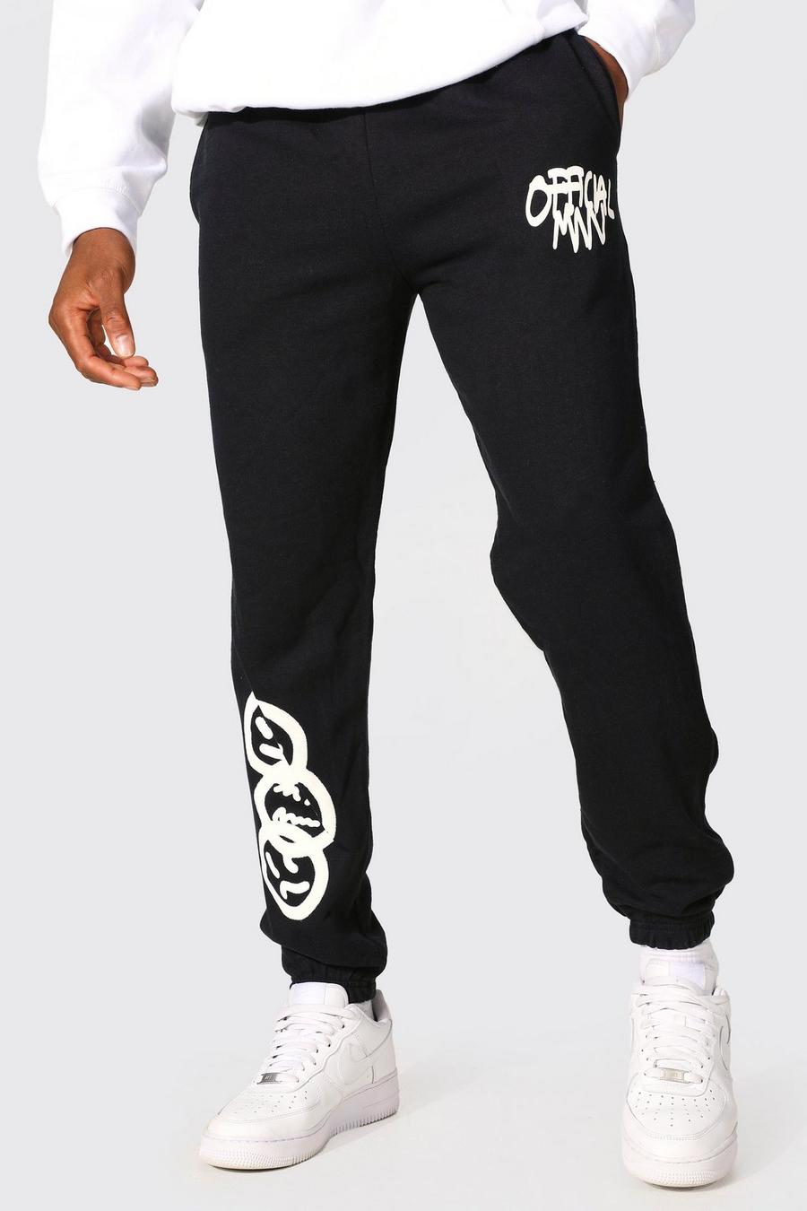 Pantalón deportivo MAN con estampado gráfico de grafiti, Black image number 1