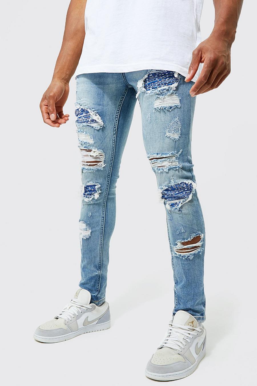 Light blue Slitna super skinny jeans med lagningar image number 1