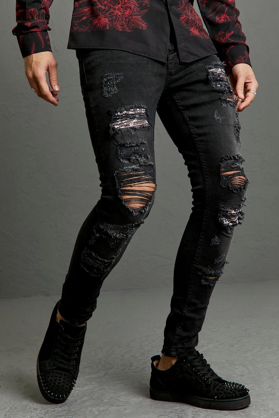 שחור ג'ינס אופנוענים סופר סקיני עם הדפס חוזר, קרעים וטלאים image number 1