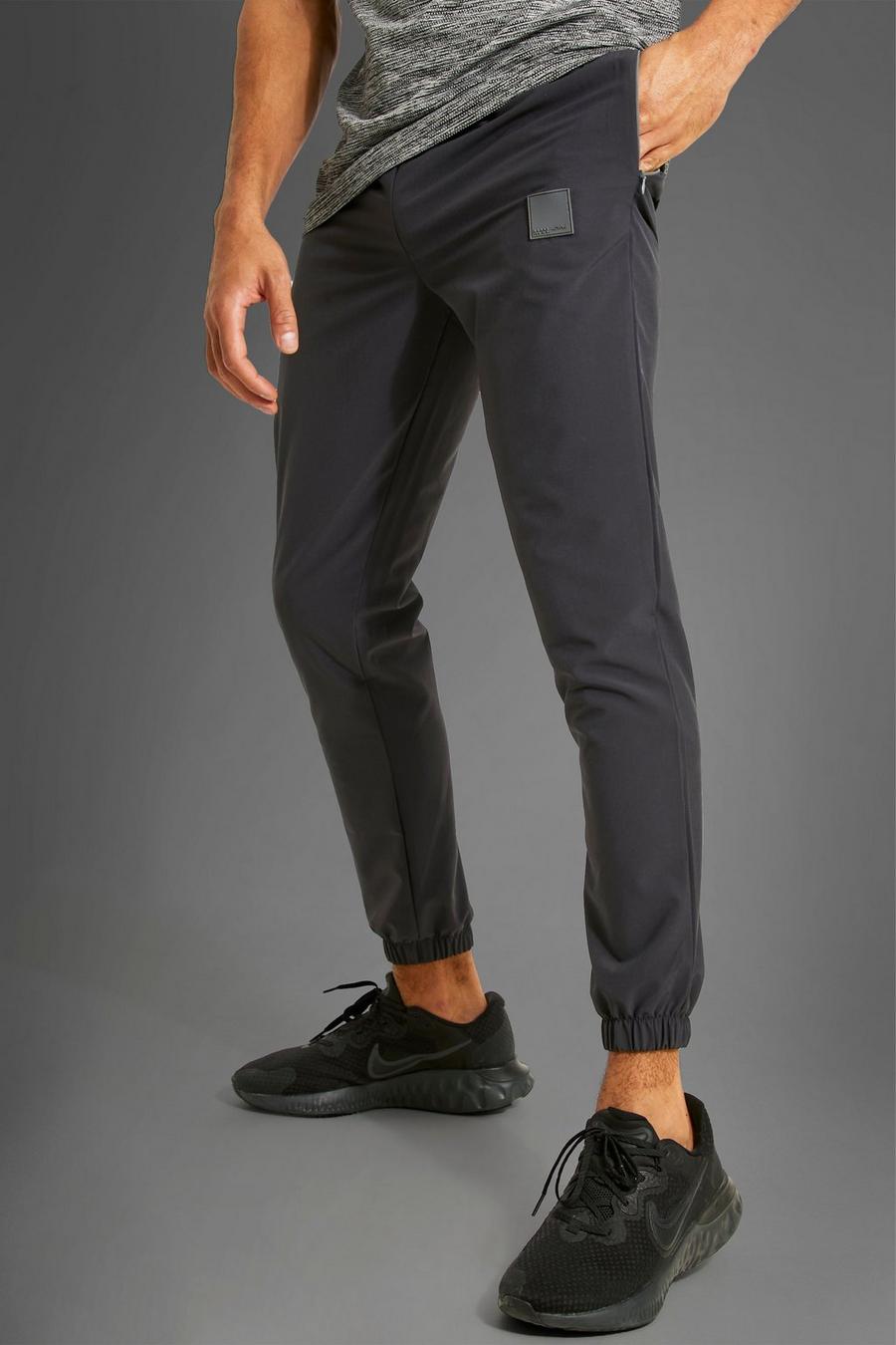 Pantalón deportivo MAN Active de tela con botamanga, Charcoal image number 1
