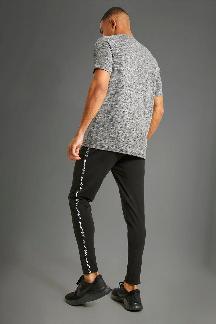 Pantalón deportivo MAN Active deportivo con franja, Black image number 1