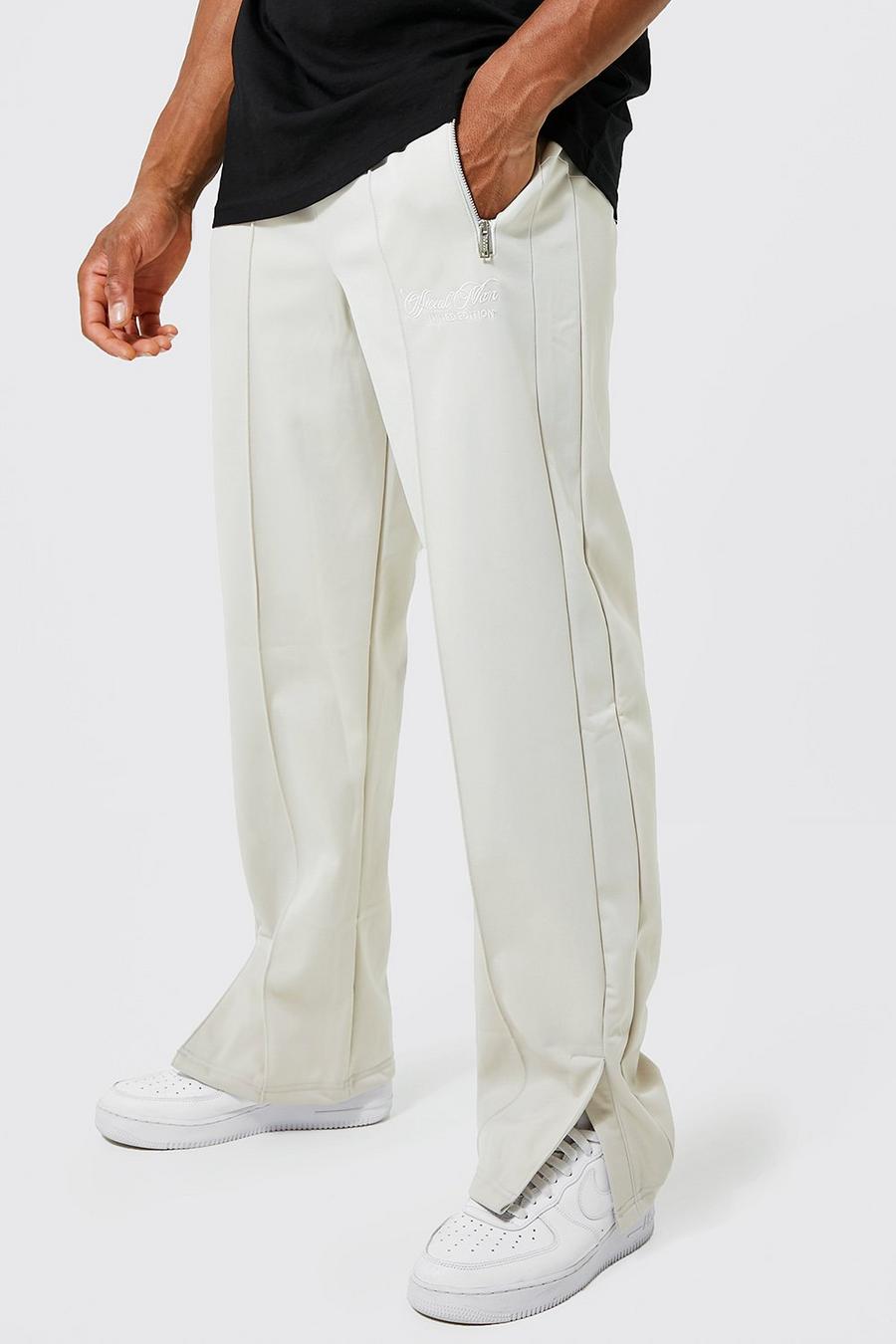 Pantalones de chándal MAN Official de tejido por urdimbre con bajo abierto, Stone image number 1