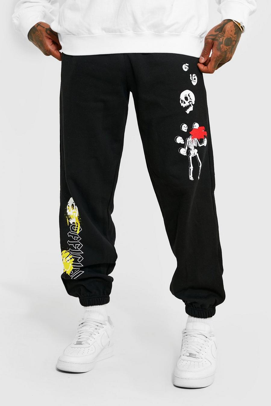 Pantalón deportivo oversize con estampado gráfico de calavera y grafiti, Black image number 1