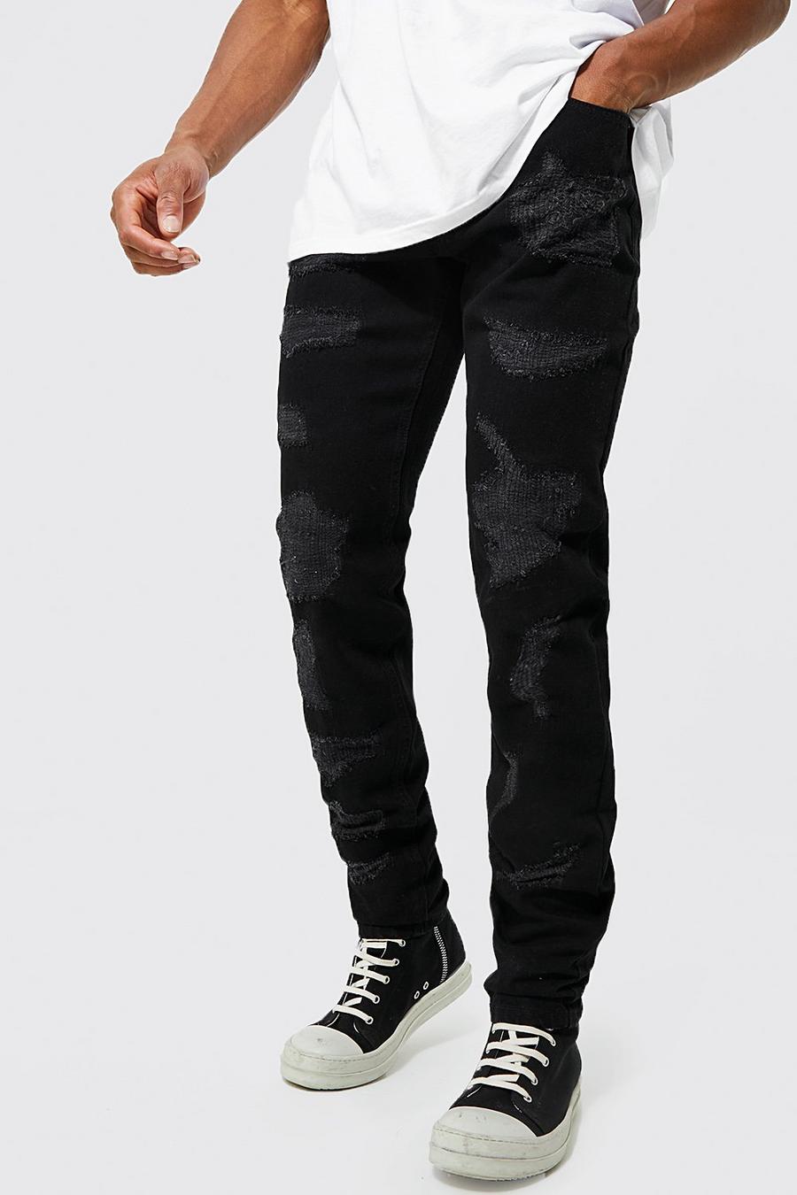 שחור אמיתי ג'ינס נערם בגזרה צרה עם תפרים בצבעים מנוגדים וקרעים image number 1