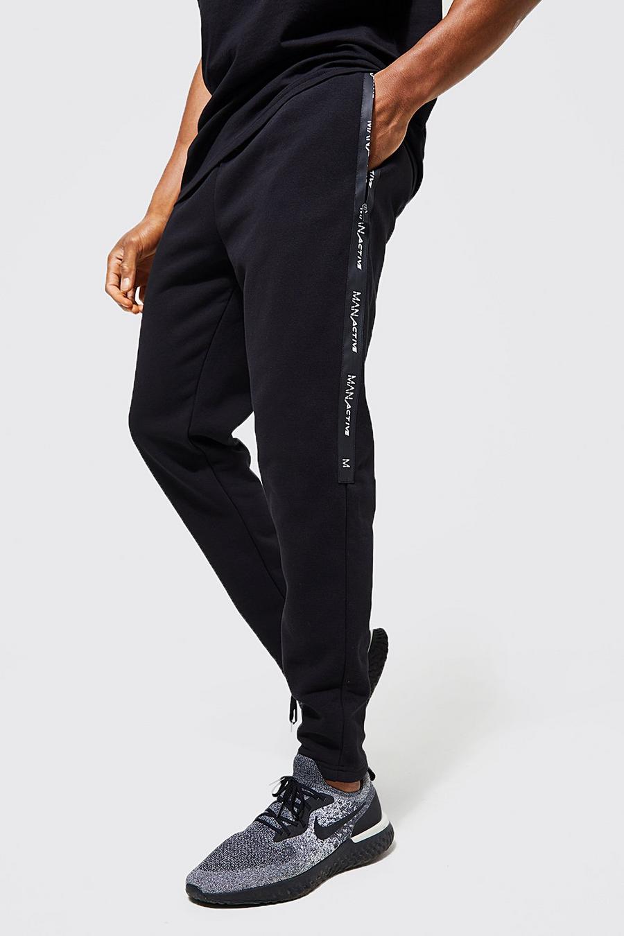 Pantaloni tuta Man Active Gym con zip, Nero image number 1