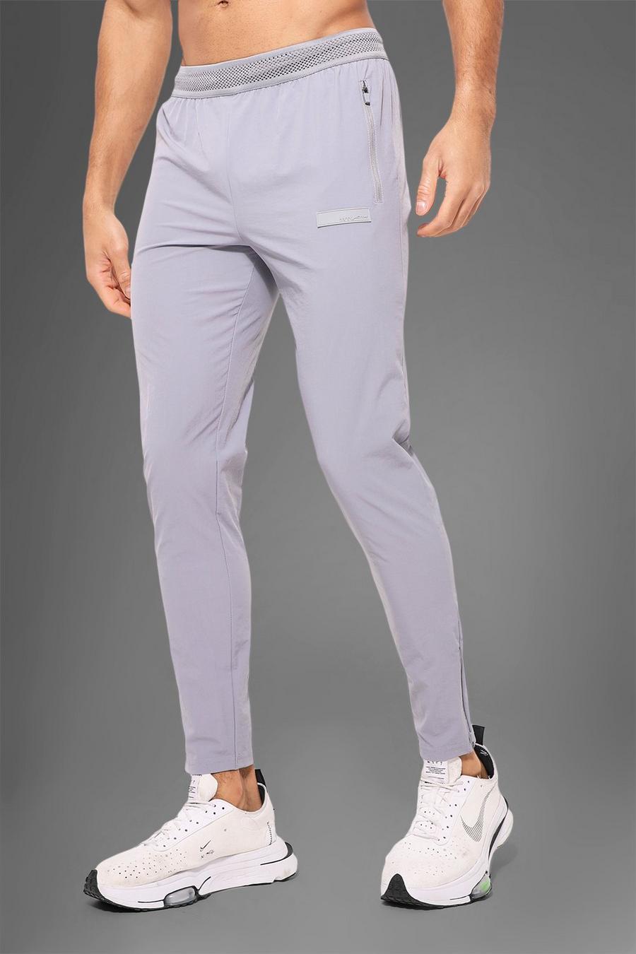 אפור gris מכנסי טרנינג לחדר הכושר עם טקסטורה וכיתוב Man Active