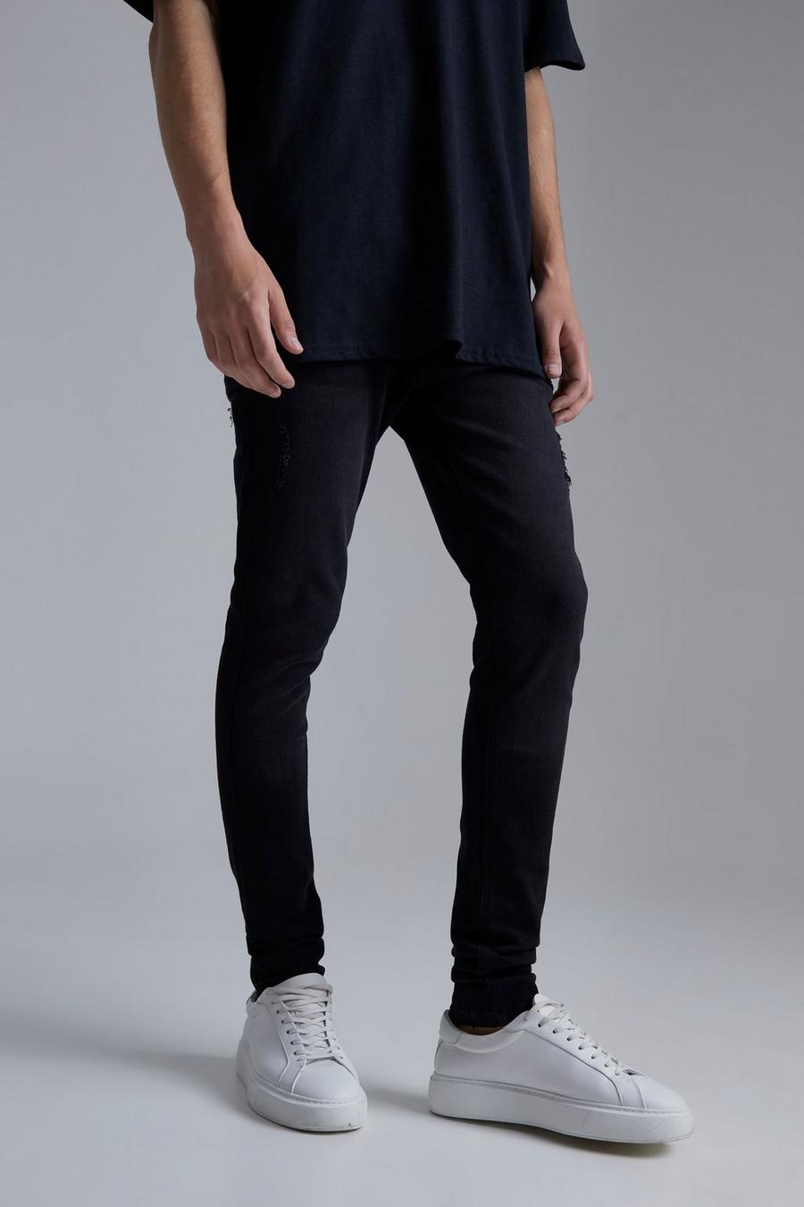 Jeans Skinny Fit in Stretch effetto smagliato con pieghe sul fondo, Washed black