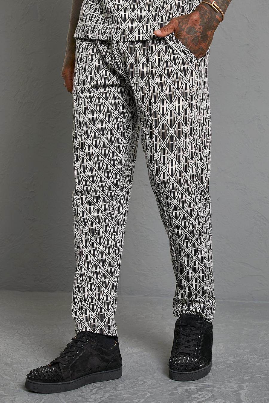 Pantaloni tuta affusolati in jacquard con stampa Man, Black nero image number 1