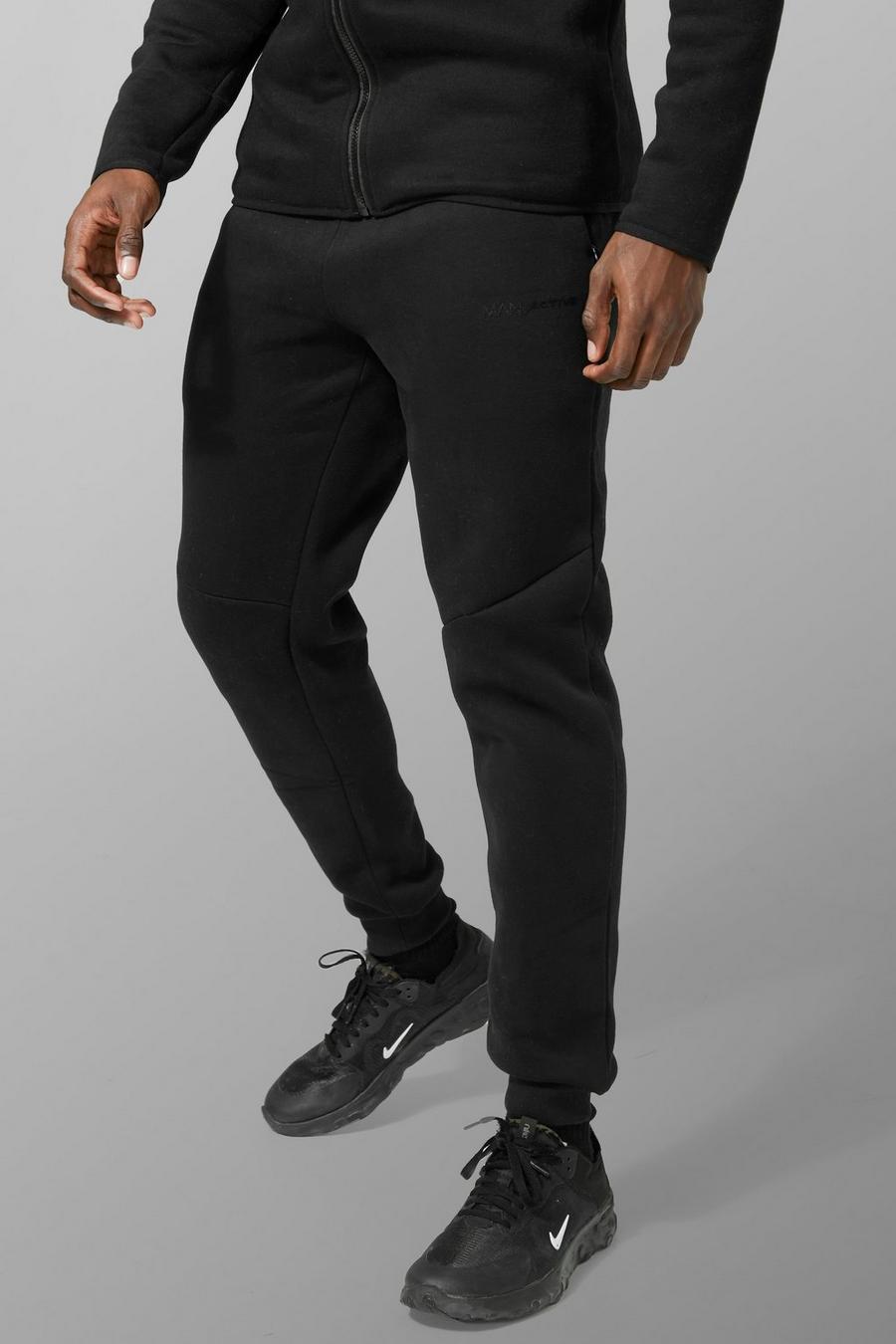 Black negro מכנסי ריצה ספורטיביים בגזרת קרסול צרה עם כיתוב Man