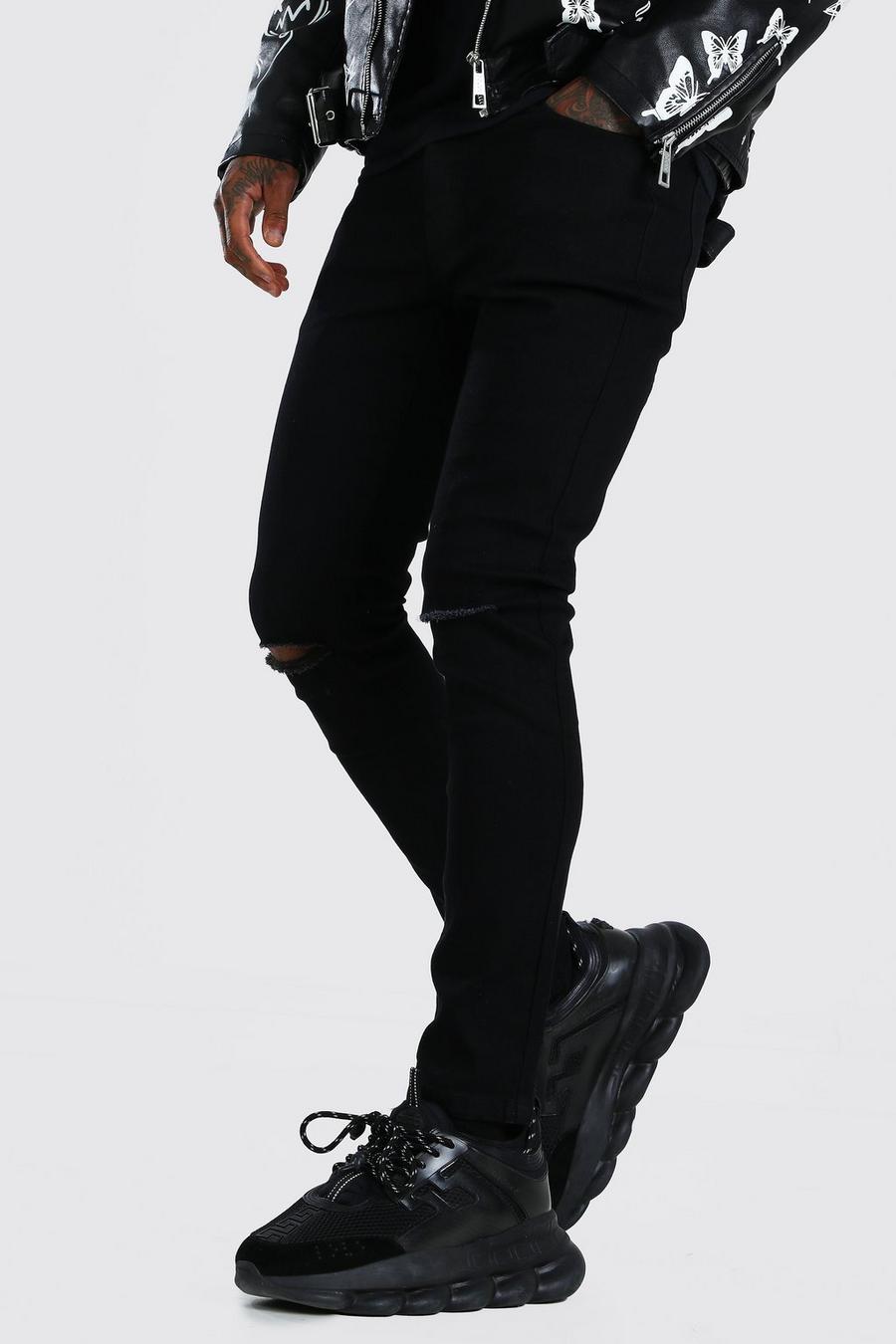 Black svart Skinny jeans med slitna knän