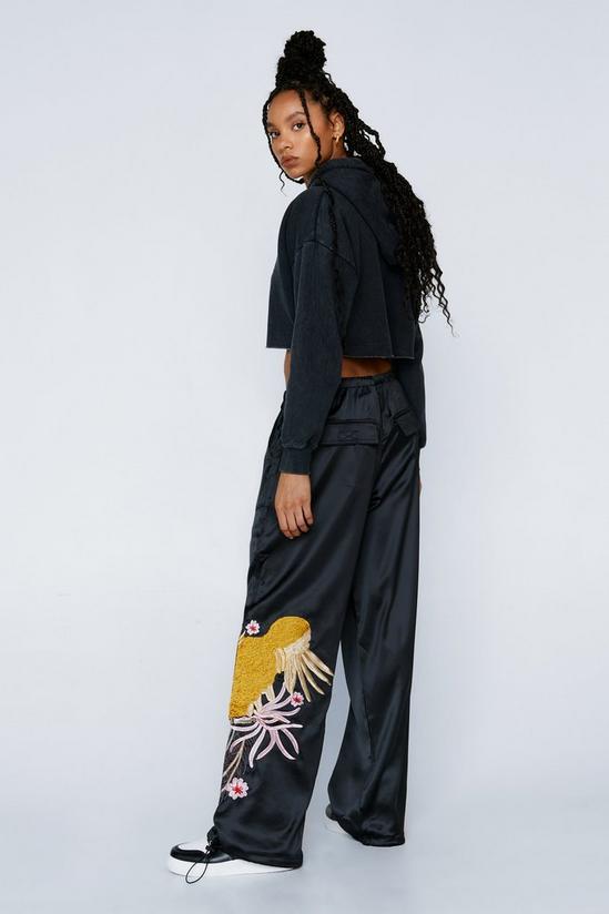 NastyGal Embroidered Parachute Nylon Mid Rise Cargo Pants 4
